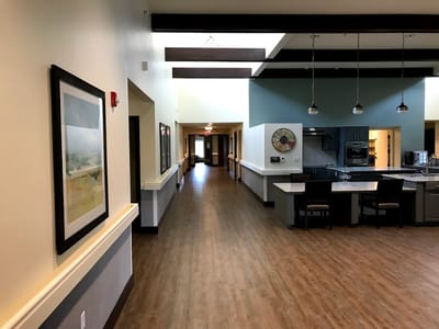 Interior hallway with kitchen area visible
