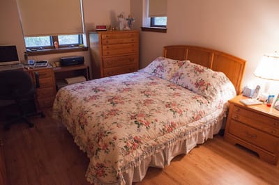 Cozy private resident room with floral bedding