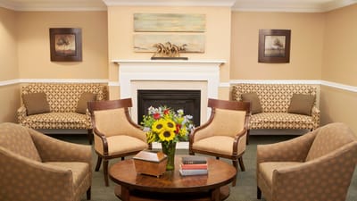 Cozy lounge area with seating and flowers