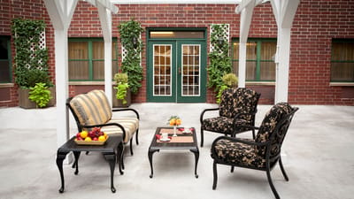 Outdoor seating area with fruit and drinks