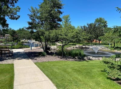 Scenic outdoor space with fountain and greenery