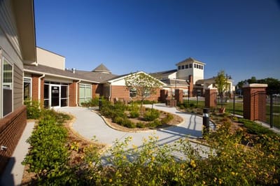 Exterior view of a landscaped assisted living facility