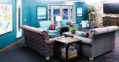 Cozy common area with seating and artwork