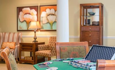 Interior common area with gaming table and decor
