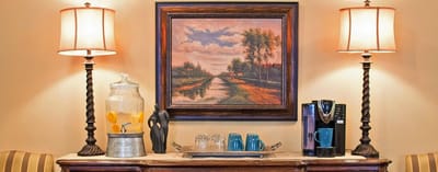 Cozy common area with coffee station and artwork
