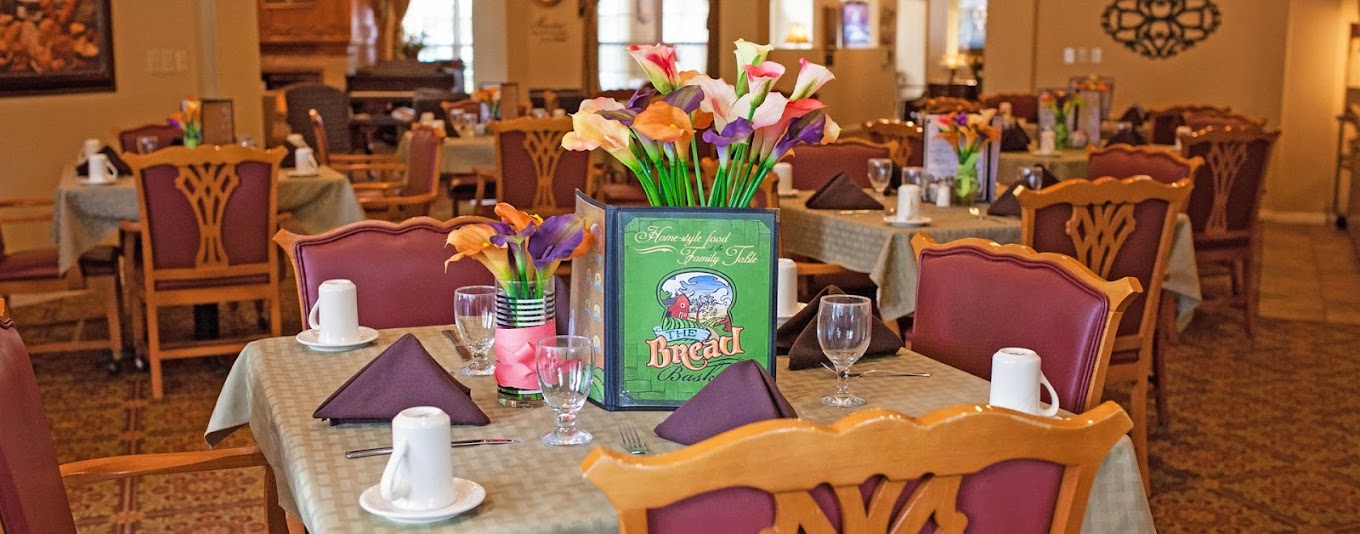 Well-set dining area with tables and flower decorations