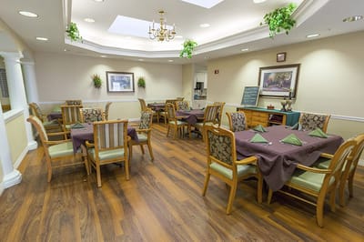 Dining area with tables set for residents