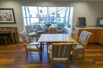 Bright common area with seating and a view