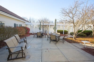 Outdoor patio area with seating and trees