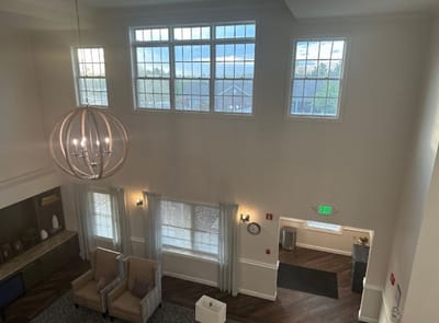 Bright lobby area with modern furniture and large windows