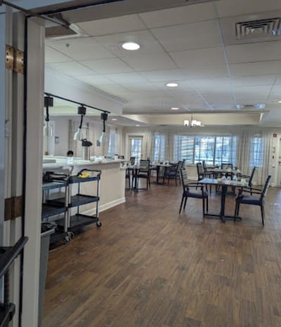 Dining area with tables and chairs in a well-lit room