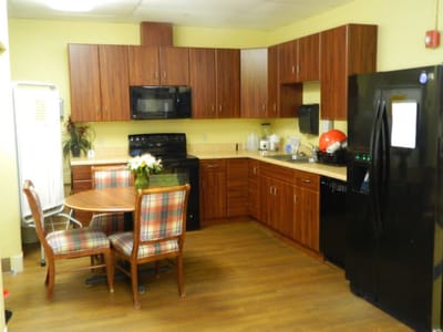 Cozy kitchen area with wooden cabinetry
