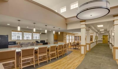 Bright common area with seating and kitchen