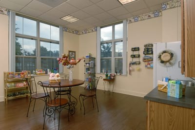 Bright common area with seating and shelves