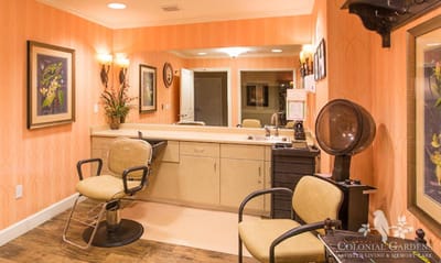Hair salon area with styling chairs and mirrors