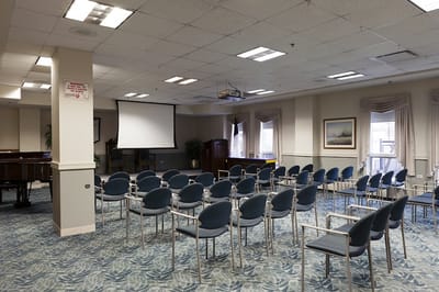 Empty activity room with chairs set up for an event