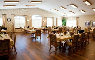 Bright dining room setup with tables and chairs
