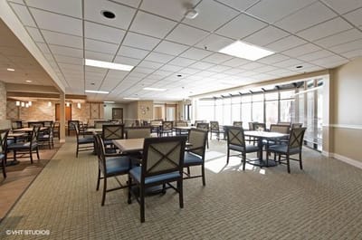 Dining area with tables and chairs in a well-lit space