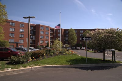 Exterior view of the assisted living facility with garden