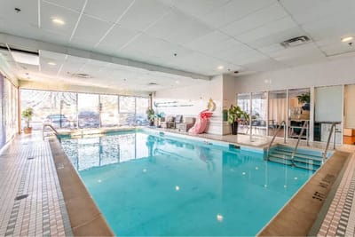 Indoor swimming pool area with natural light