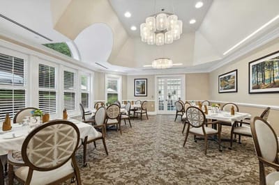 Bright dining room with elegant decor and tables set
