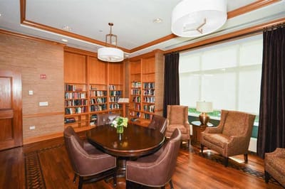 Cozy reading area with bookshelves and seating
