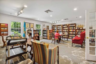 Residents enjoying the library in a common area