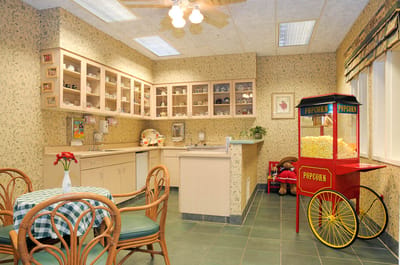 Bright interior common area with a popcorn cart