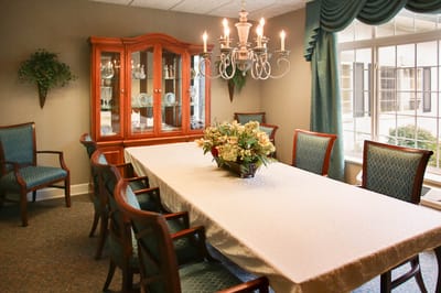 Dining room with a large table and chandelier