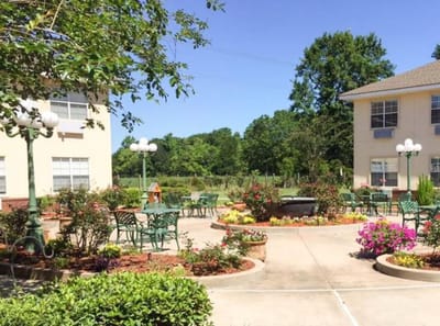 Outdoor courtyard with seating and flowers