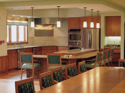 Interior view of a dining area with kitchen
