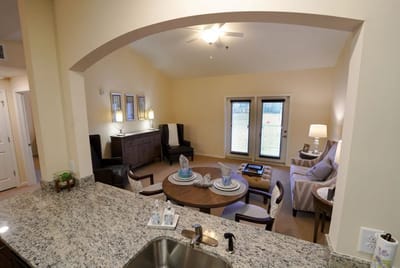 Well-furnished living room area in a senior facility