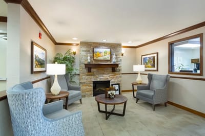 Cozy common area with comfortable seating and a fireplace