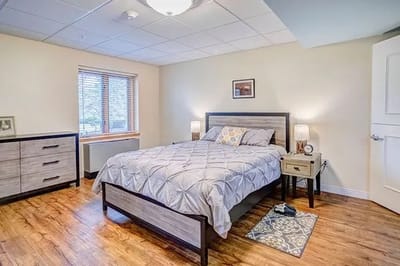 Well-furnished private resident room with bed and drawer