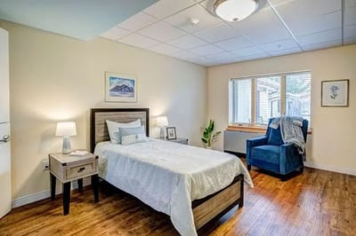 Bright interior of a resident's room with a single bed