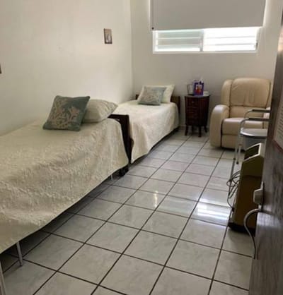 A private resident room with two beds