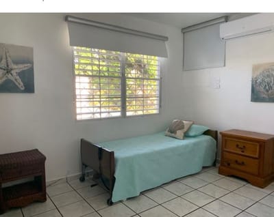 Private resident room with bed and decor