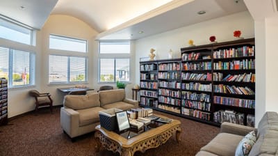 Cozy common area with bookshelves and seating