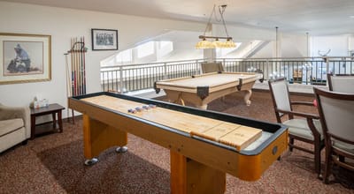 Common area with shuffleboard and pool table