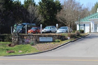 Exterior view of Arbor Terrace facility entrance