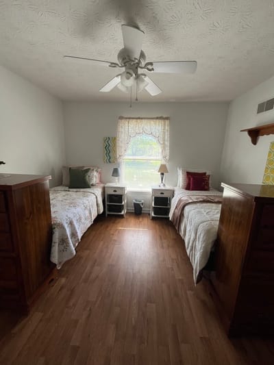 Twin resident bedrooms with natural light