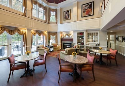 Bright common area with seating and tables