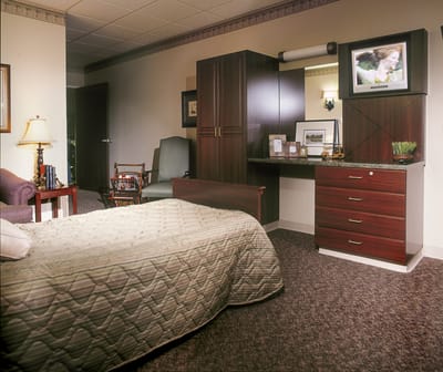Cozy private resident room with furniture and TV