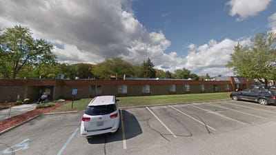 Exterior view of Mission Point of Nursing & Physical Rehabilitation Center with parking lot