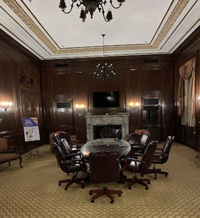 Elegant conference room with a round table and leather chairs