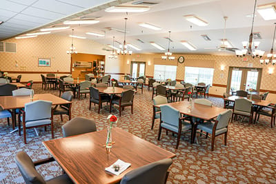 Bright dining area with tables and chairs