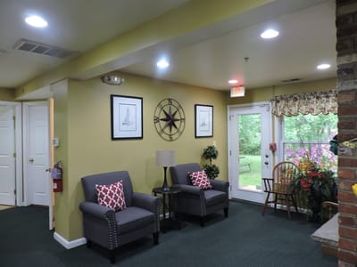 Interior view of a cozy common area with seating