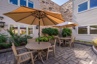 Outdoor seating area with umbrellas in a courtyard