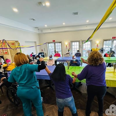 Residents participating in a colorful indoor activity