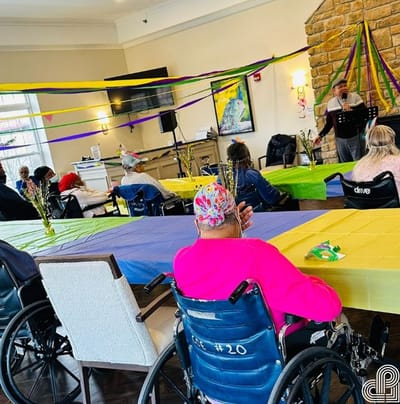 Residents participating in a decorated activity room